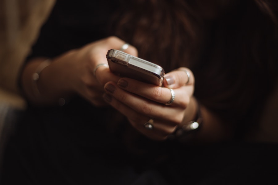 anonymous person shopping on phone